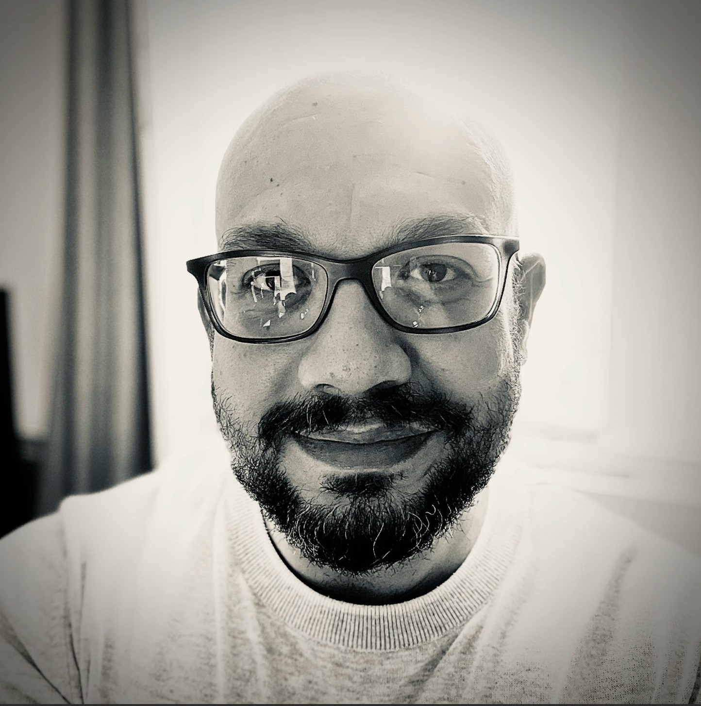 A image of a concrete sphere, balanced between two other larger spheres